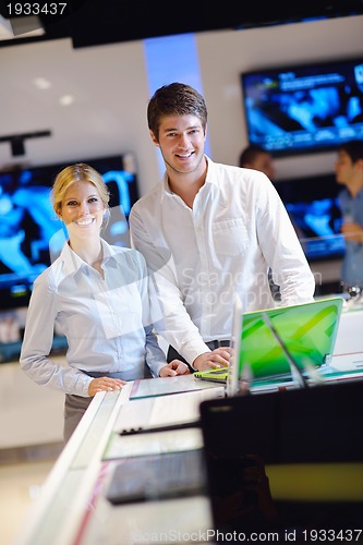 Image of people buy  in consumer electronics store