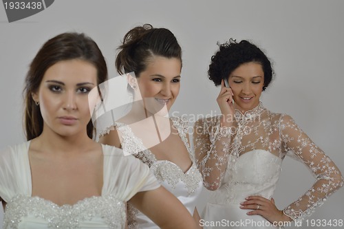 Image of portrait of a three beautiful woman in wedding dress