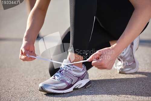 Image of Couple doing stretching exercise  after jogging