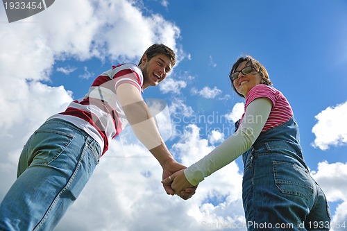 Image of romantic young couple in love together outdoor