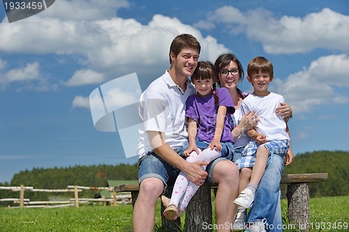 Image of happy young family have fun outdoors