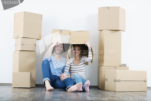 Image of Young couple moving in new house