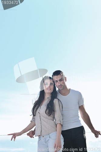 Image of couple relaxing on balcony