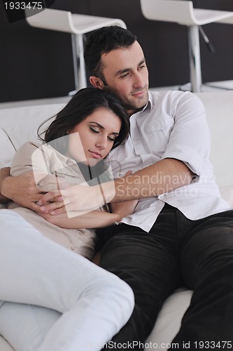 Image of happy young couple relax at home