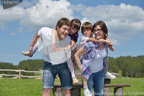 Image of happy young family have fun outdoors