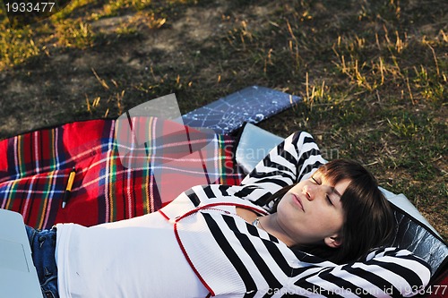 Image of young teen girl work on laptop outdoor