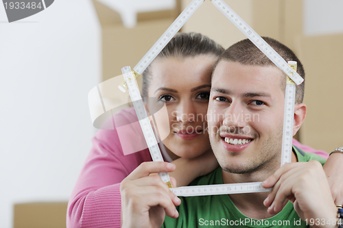 Image of Young couple moving in new house