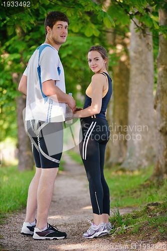 Image of Young couple jogging