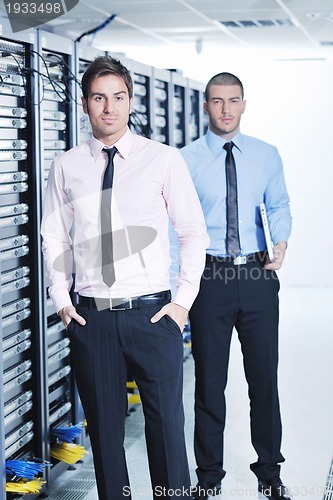 Image of it enineers in network server room