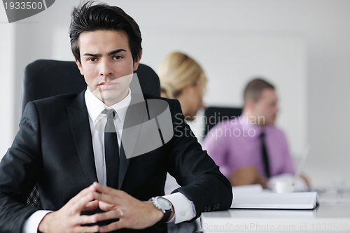 Image of young business man at meeting