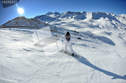 Image of skiing on fresh snow at winter season at beautiful sunny day