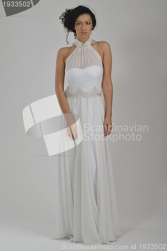 Image of elegant woman in fashionable dress posing in the studio