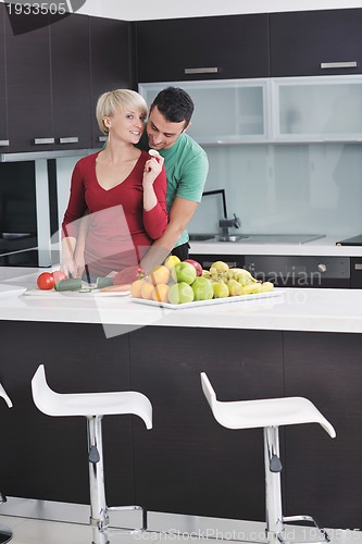Image of young couple have fun in modern kitchen