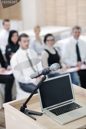 Image of laptop on conference speech podium