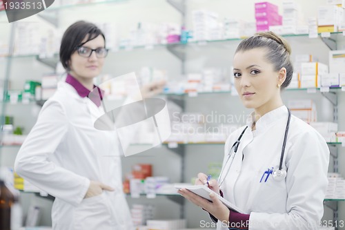 Image of team of pharmacist chemist woman  in pharmacy drugstore