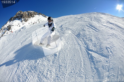 Image of skiing on fresh snow at winter season at beautiful sunny day