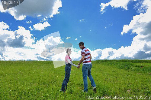 Image of romantic young couple in love together outdoor