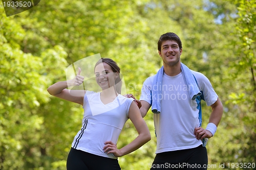 Image of Young couple jogging