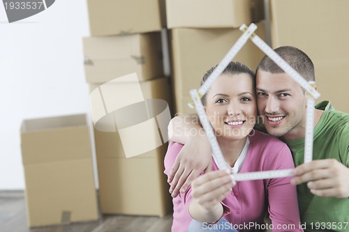 Image of Young couple moving in new home