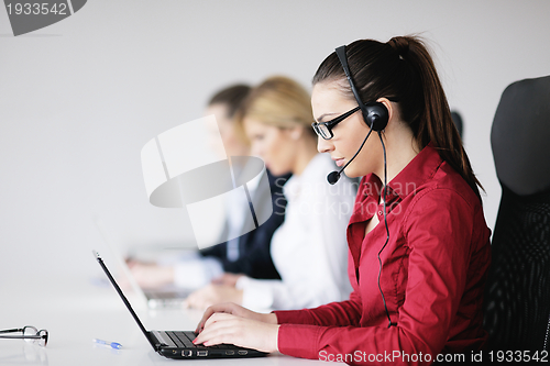 Image of business woman group with headphones