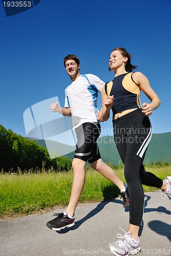 Image of Young couple jogging