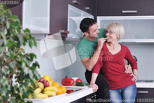 Image of young couple have fun in modern kitchen