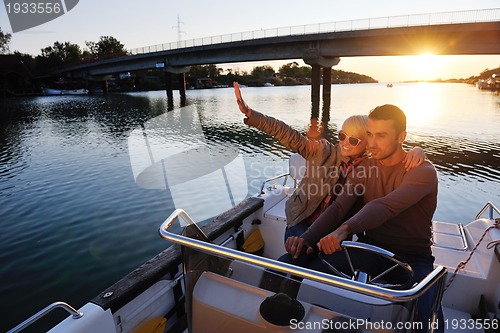 Image of couple in love  have romantic time on boat