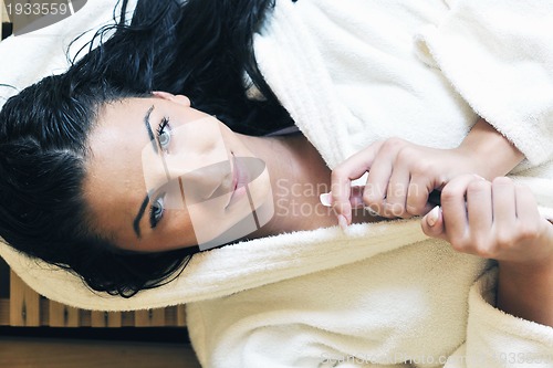 Image of Young woman take a steam bath