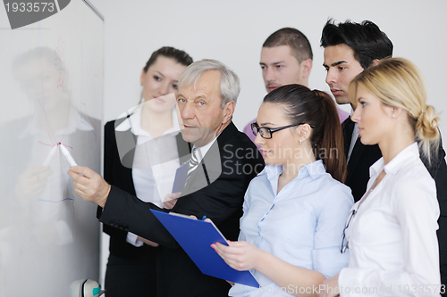 Image of Senior business man giving a presentation