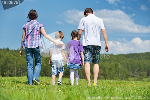 Image of happy young family have fun outdoors