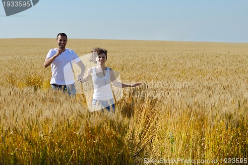 Image of happy couple in wheat field