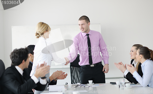 Image of Group of young business people at meeting