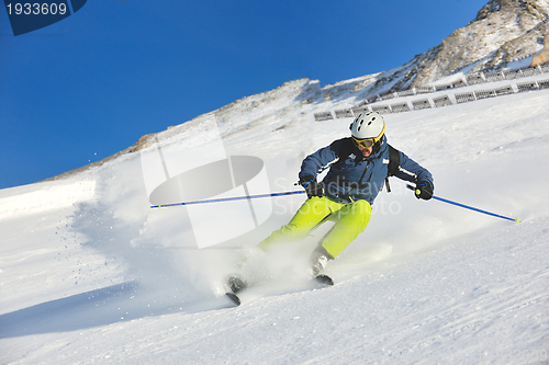 Image of skiing on fresh snow at winter season at beautiful sunny day