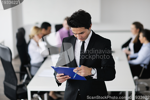 Image of young business man at meeting