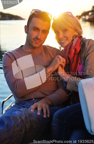 Image of couple in love  have romantic time on boat