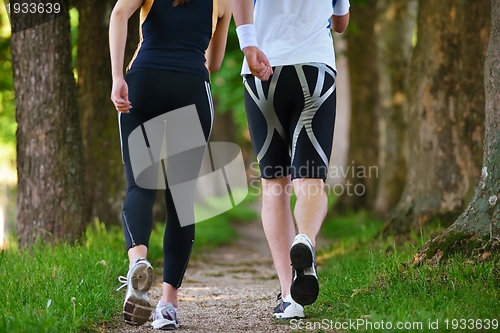 Image of Young couple jogging