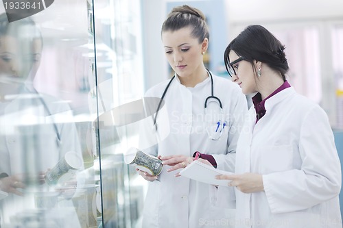 Image of team of pharmacist chemist woman  in pharmacy drugstore