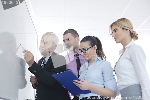Image of Senior business man giving a presentation