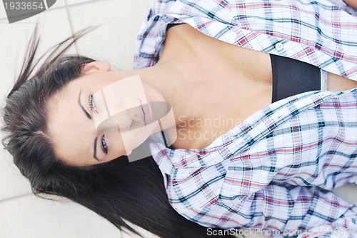 Image of beautiful young lady posing in garden