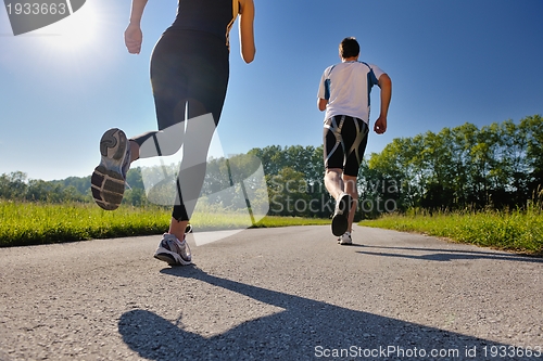 Image of Young couple jogging