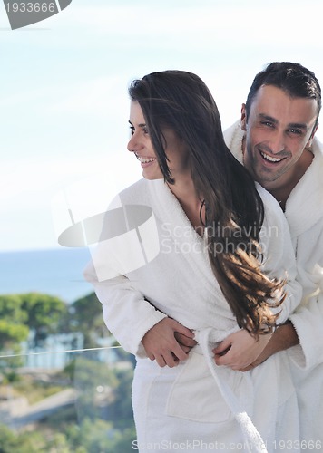 Image of couple relaxing on balcony