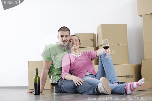 Image of Young couple moving in new home