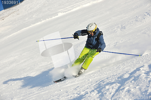 Image of skiing on fresh snow at winter season at beautiful sunny day