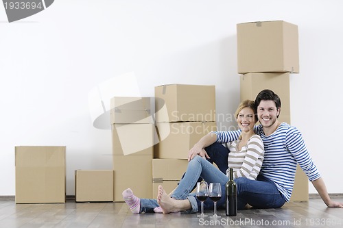 Image of Young couple moving in new home