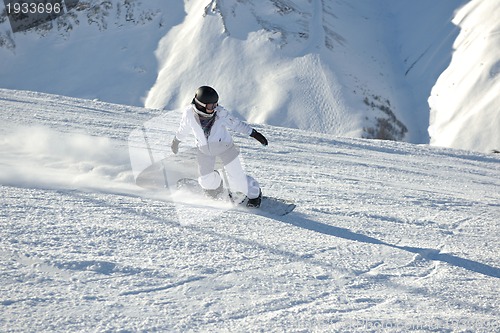 Image of skiing on fresh snow at winter season at beautiful sunny day