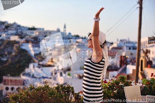 Image of Greek woman on the streets of Oia, Santorini, Greece