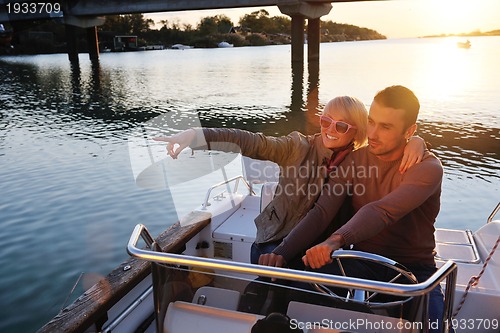 Image of couple in love  have romantic time on boat