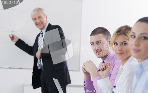 Image of Senior business man giving a presentation