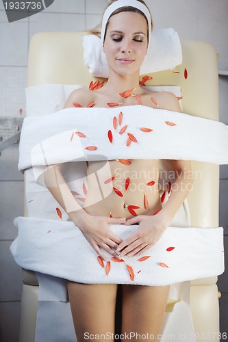 Image of Beautiful young woman in spa