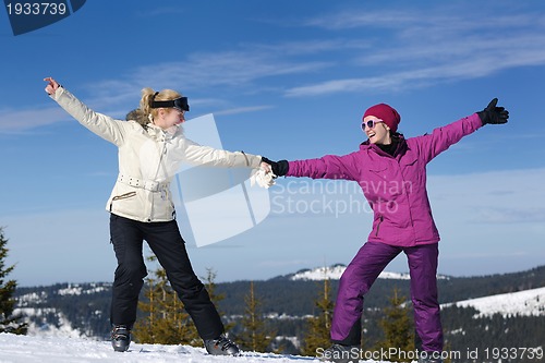 Image of winter season fun with group of girls